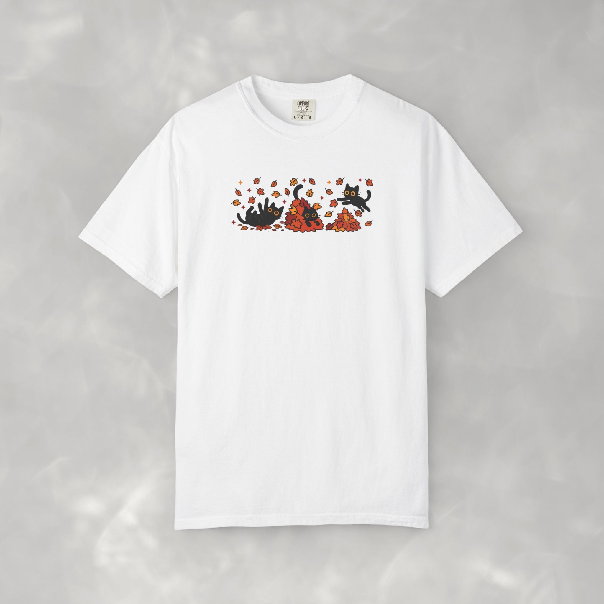 Cute Black Cats Playing in Autumn Leaves Comfort Colors Tee