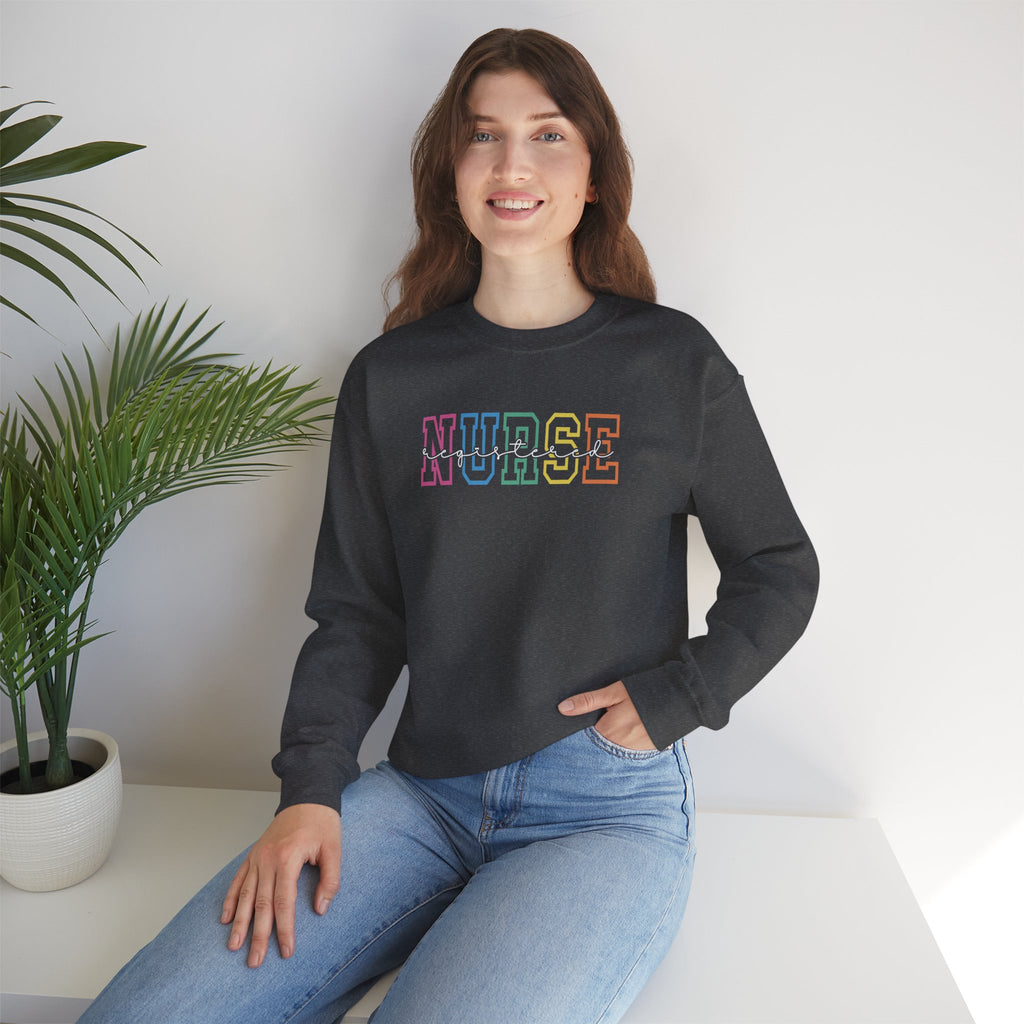 Colorful Rainbow Whimsical Varsity Registered Nurse Gildan Unisex Heavy Blend™ Crewneck Sweatshirt
