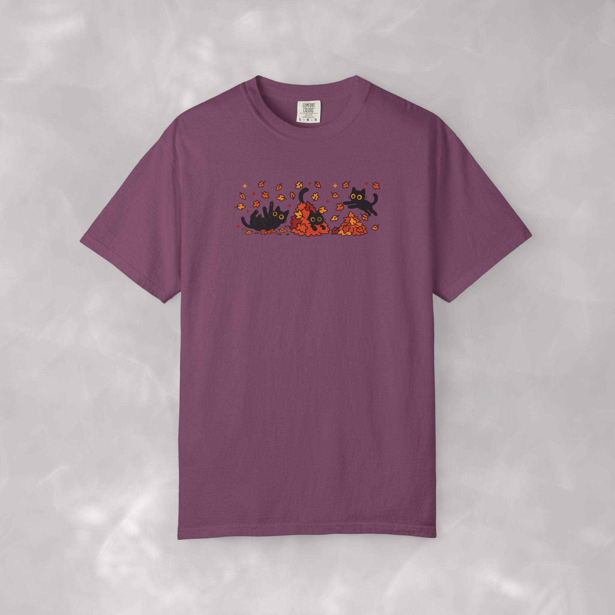 Cute Black Cats Playing in Autumn Leaves Comfort Colors Tee