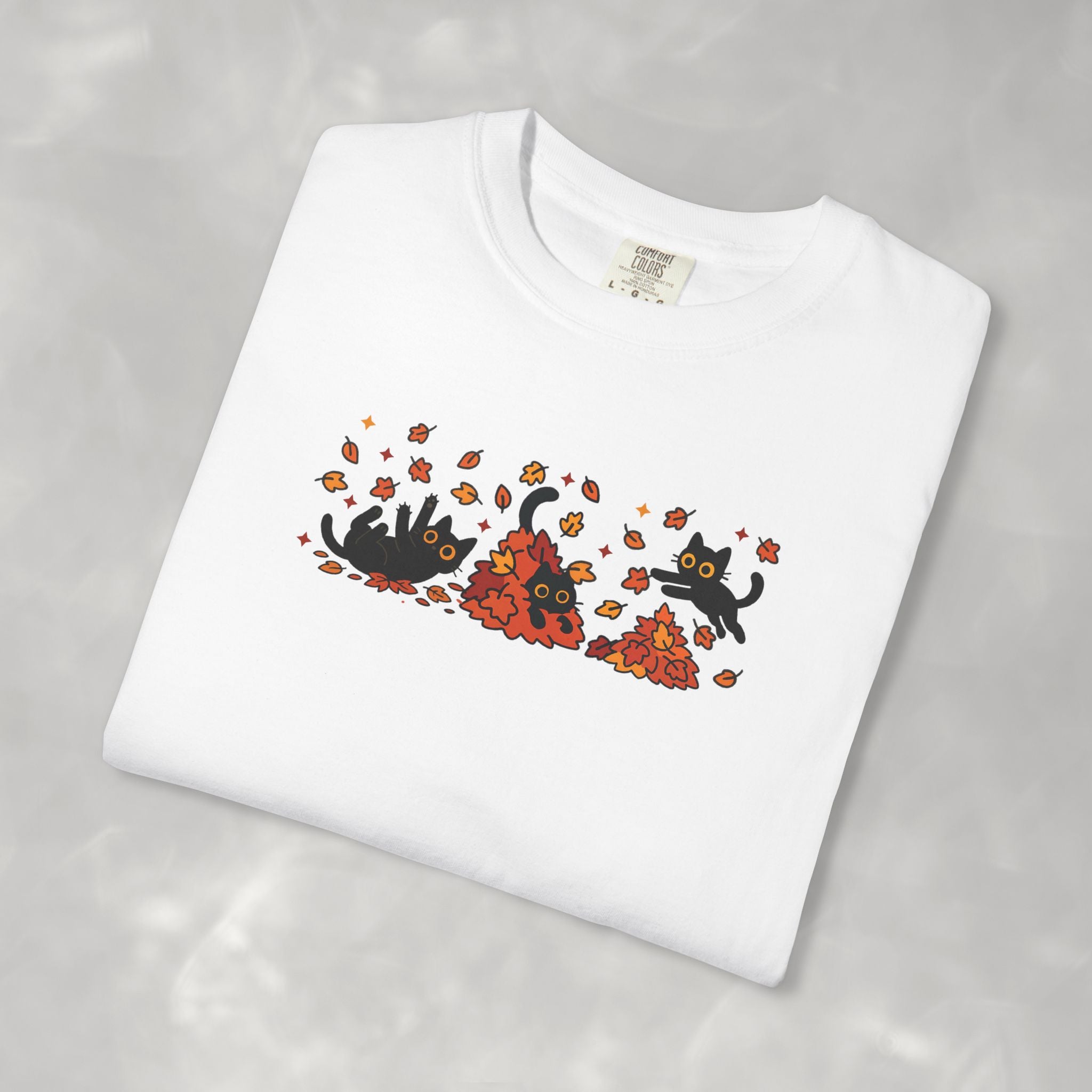 Cute Black Cats Playing in Autumn Leaves Comfort Colors Tee