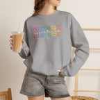 Colorful Rainbow Whimsical Varsity Registered Nurse Gildan Unisex Heavy Blend™ Crewneck Sweatshirt